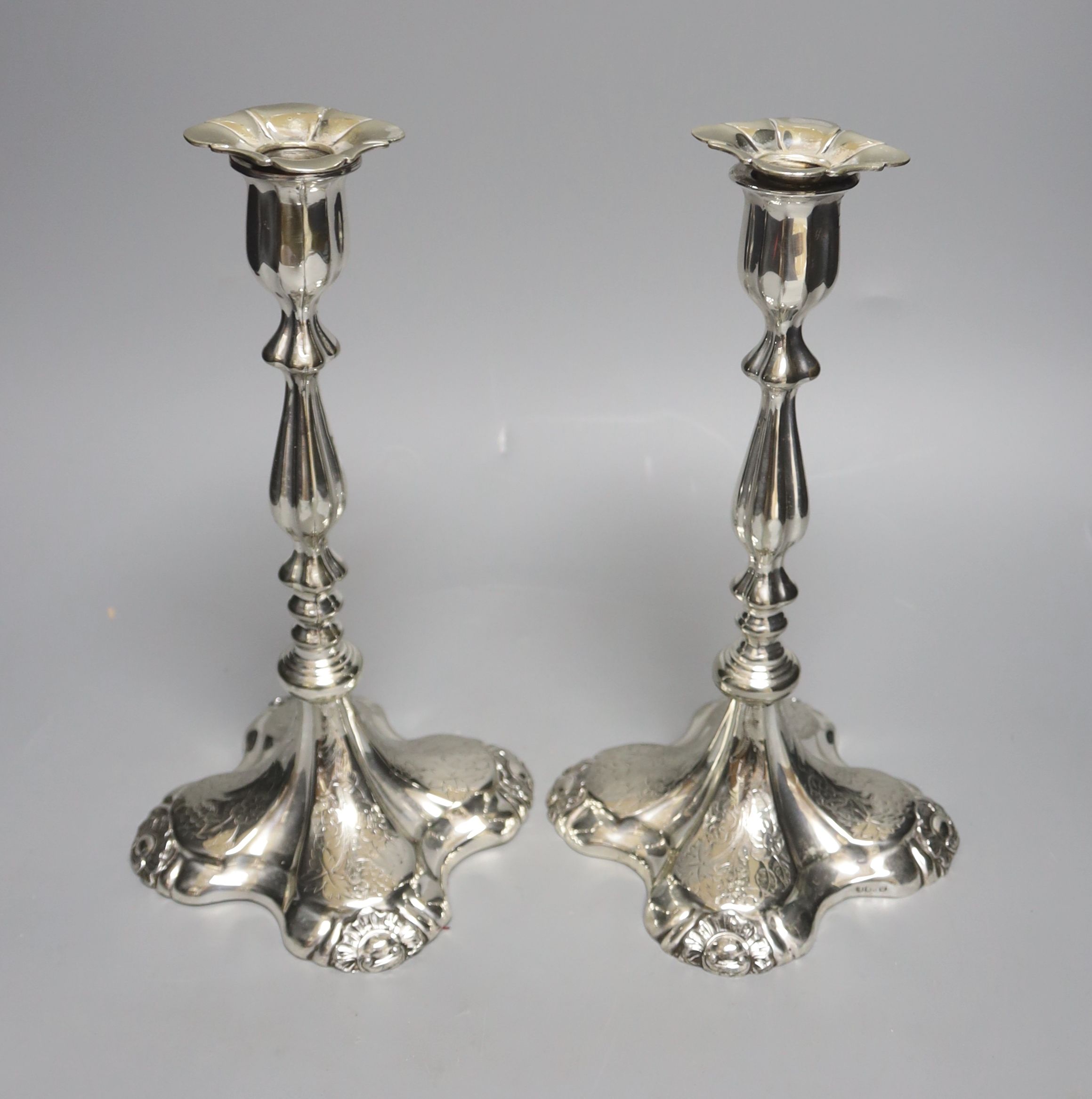 A pair of plated candlesticks, height 26cm